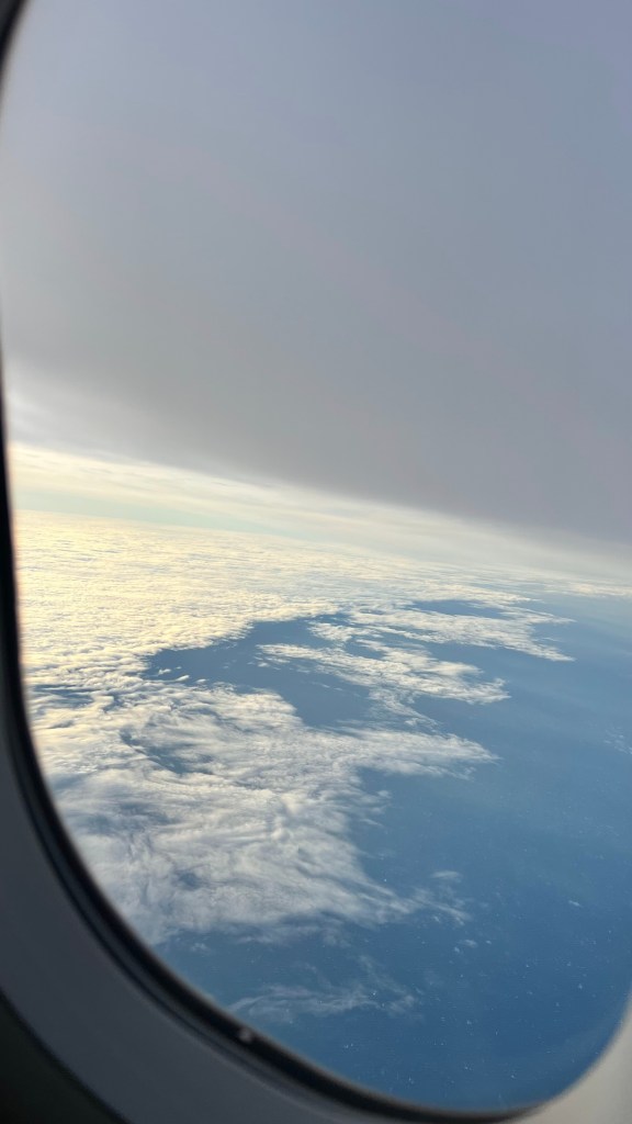 A picture of clouds from the aeroplane window