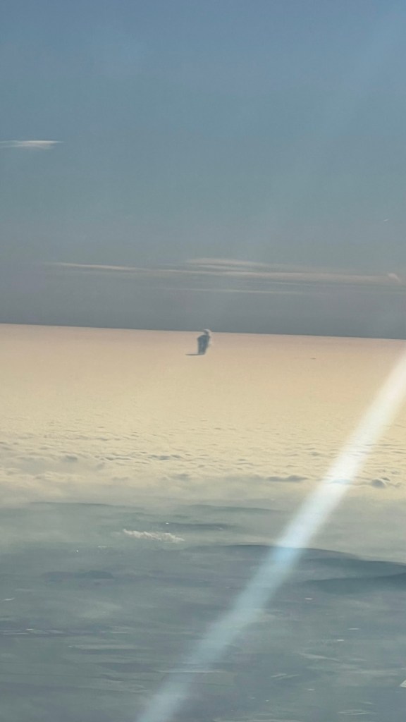 A picture of clouds from the aeroplane window
